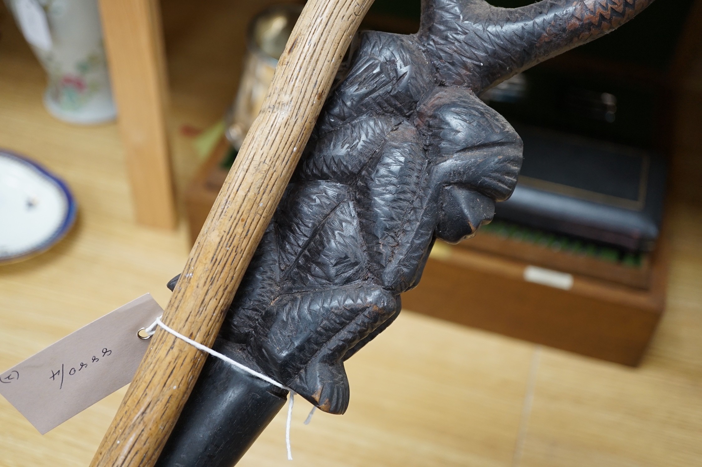 An African carved wood walking cane and a ‘dogs head’ walking cane